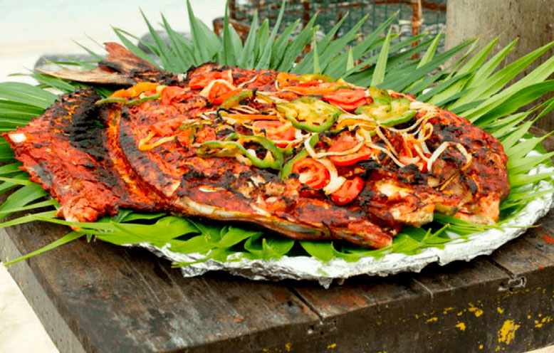 Descubre el sabor del Tikinxic: El platillo emblemático de Cancún