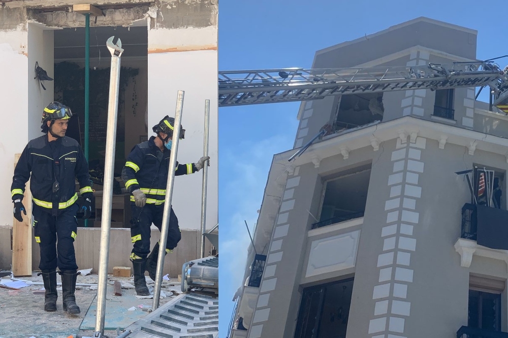 Los bomberos de Madrid laboran para sacar a personas atrapadas dentro del edificio que registró la explosión